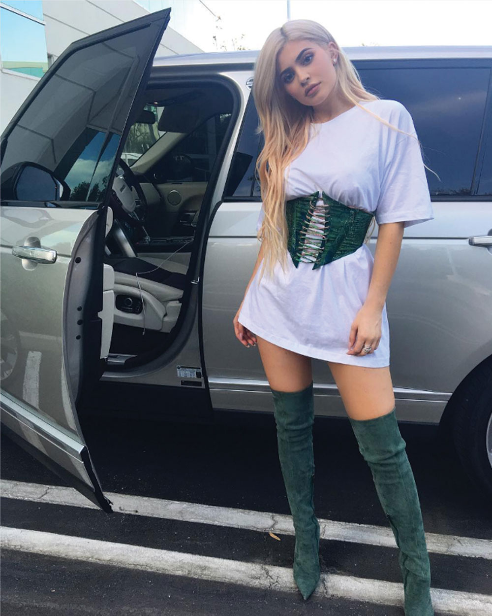Kylie Jenner's dark green boots and corset combo is risqué but cute.