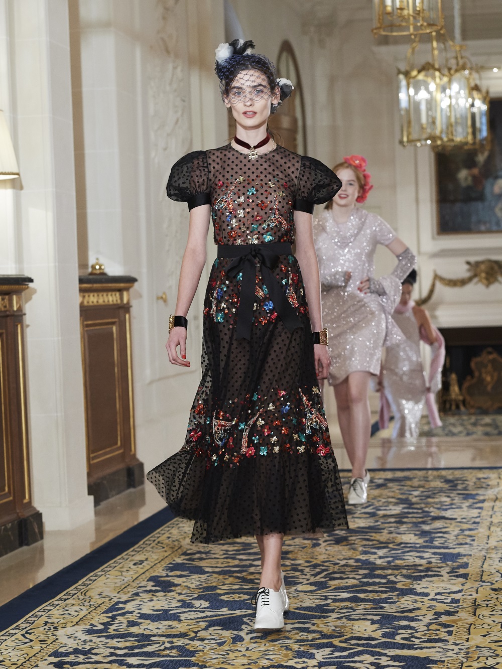A model on the runway at Chanel's pre-fall 2017 collection at The Ritz