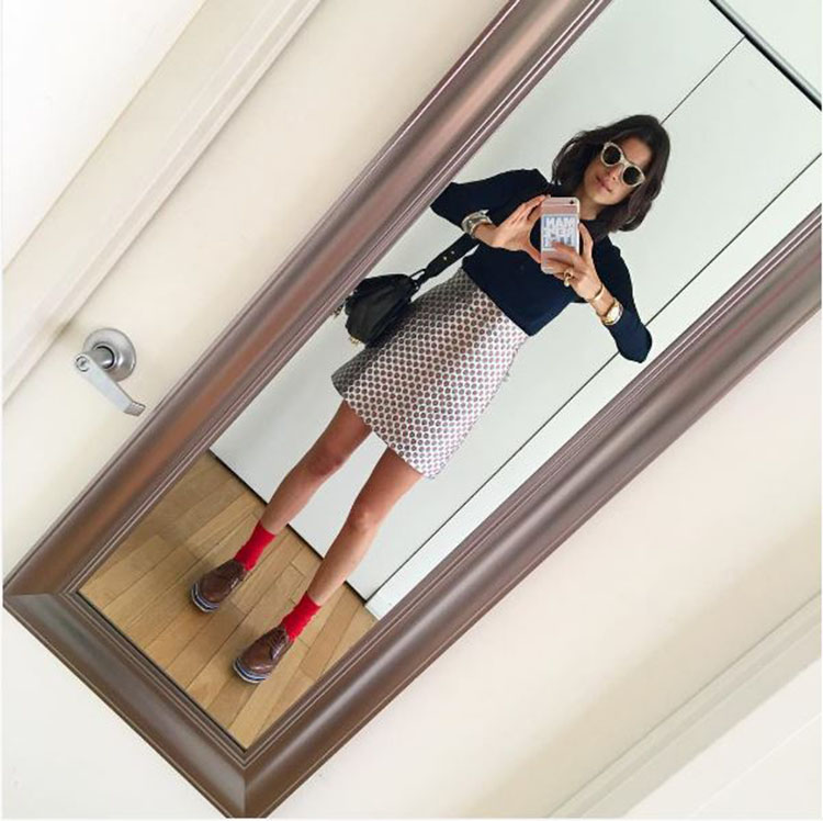 The Man Repeller herself showing us all that the mini skirt and loafer combo is a definite winning look.