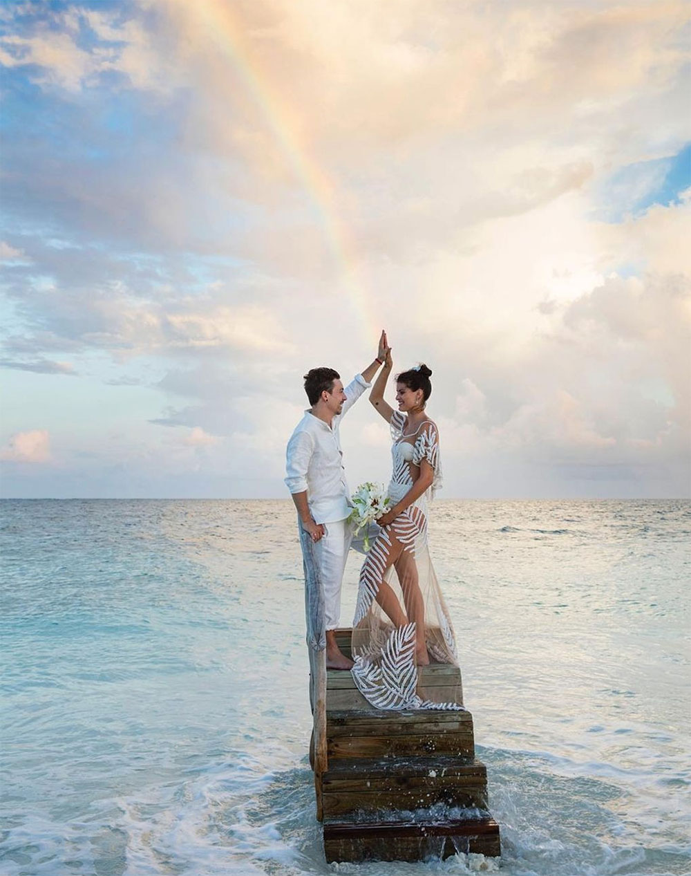 Brazilian-born supermodel beauty Isabeli Fontana got married - in a see-through Água de Coco gown, complete with a bikini underneath - to singer Diego Ferrero. The exclusive ceremony was held on the beach at the Soneva Fushi resort in the Maldives. Luxe!