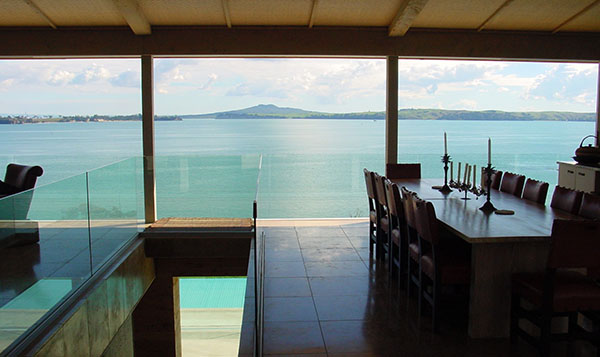 Fossil Cove Estate The 5 bedroom, 5 bathroom property is almost all glass, so occupants can easily take in the sweeping view of Rangitoto Island.