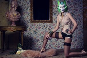 Model Karen Elson wear lingerie and a fish mask of makeup in Italian Vogue