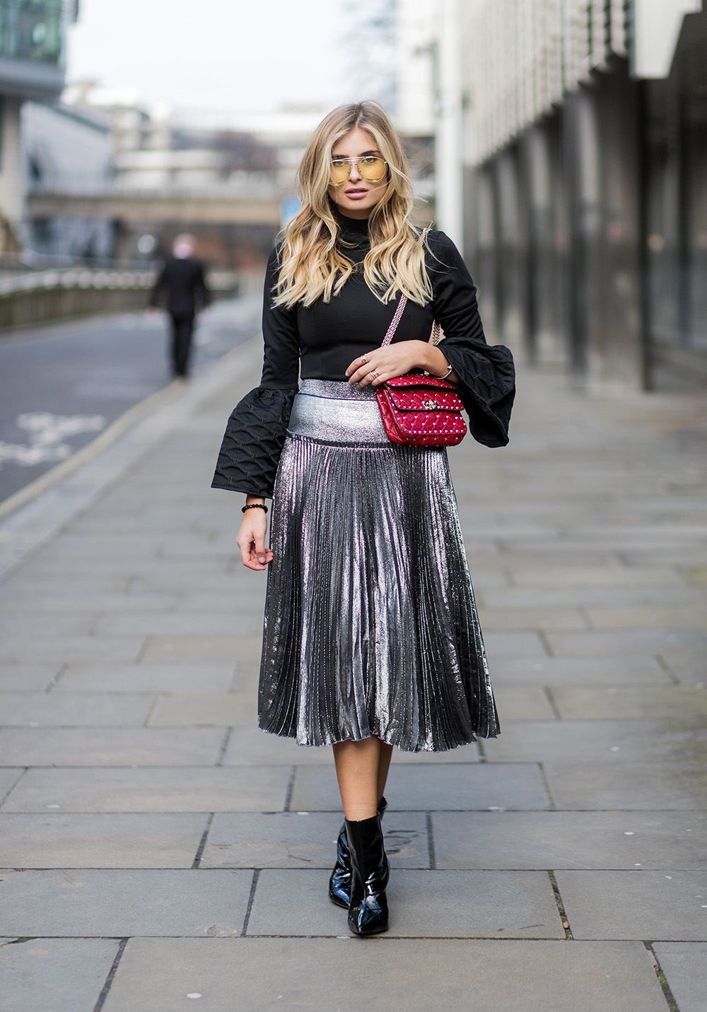 LONDON, ENGLAND - FEBRUARY 18: Xenia van der Woodsen wearing a black knit, silver skirt, yellow sunglasses outside Julien Macdonald on day 2 of the London Fashion Week February 2017 collections on February 18, 2017 in London, England. (Photo by Christian Vierig/Getty Images)
