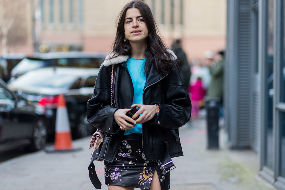 LONDON, ENGLAND - FEBRUARY 19: Leandra Medine wearing a black leather jacket, mini skirt outside Topshop Unique on day 3 of the London Fashion Week February 2017 collections on February 19, 2017 in London, England. (Photo by Christian Vierig/Getty Images)