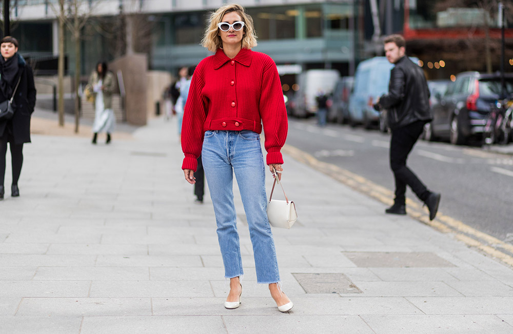 LONDON, ENGLAND - FEBRUARY 19: Anne Laure Mais wearing a red jacket, denim jeans outside Topshop Unique on day 3 of the London Fashion Week February 2017 collections on February 19, 2017 in London, England. (Photo by Christian Vierig/Getty Images)