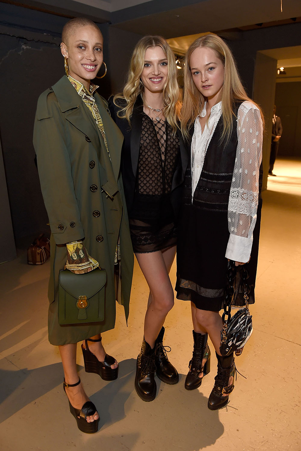 LONDON, ENGLAND - FEBRUARY 20: (L-R) Adwoa Aboah, Lily Donaldson and Jean Campbell wearing Burberry attend the Burberry February 2017 Show during London Fashion Week February 2017 at Makers House on February 20, 2017 in London, England. (Photo by David M. Benett/Dave Benett/Getty Images for Burberry)