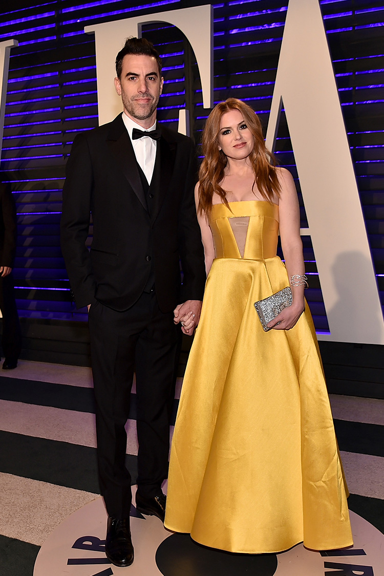 Isla Fisher joked she was auditioning for Beauty and the Beast in her bold yellow gown by fellow Australian Alex Perry.