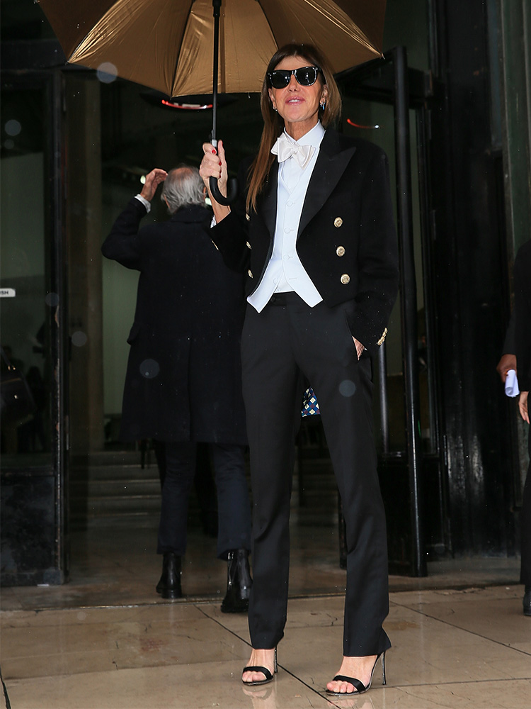 Vogue Japan editor and street style star Anna dello Russo braved the rain at Paris Fashion week in a luxury tux by tailor Bottega Dalmut.