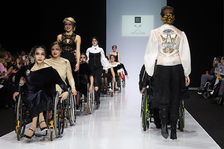 MOSCOW, RUSSIA - MARCH 23, 2017: Models showcase creations during a catwalk show for the NP Open World collection at the Moscow Fashion Week, at the Gostiny Dvor Shopping and Exhibition Centre. Open World is a non-profit partnership helping integrate people with disabilities. Vyacheslav Prokofyev/TASS (Photo by Vyacheslav ProkofyevTASS via Getty Images)