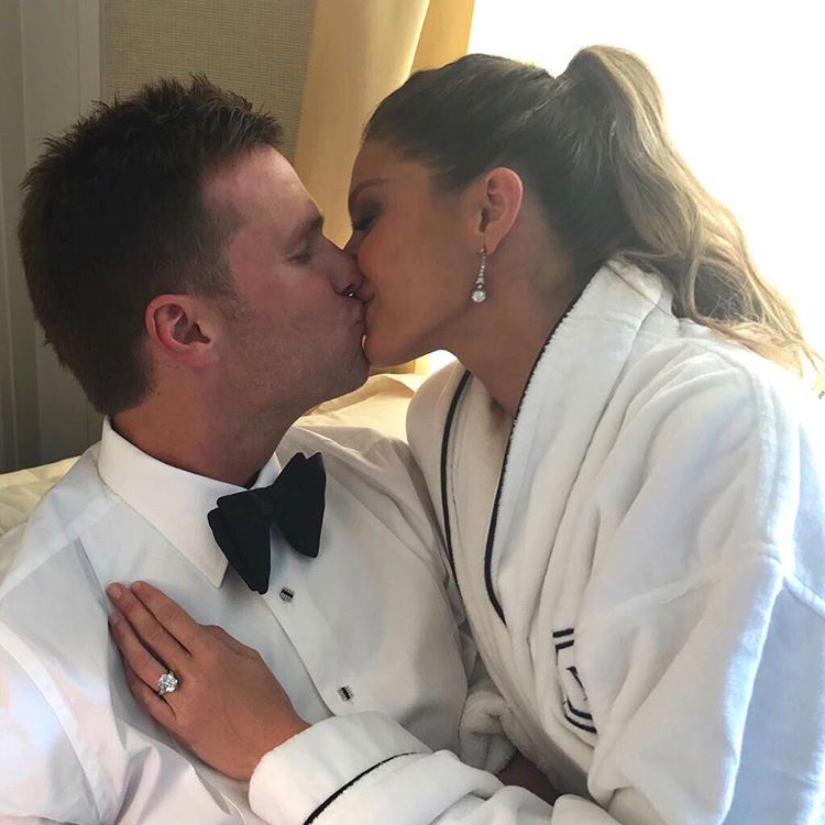 Gisele Bundchen and husband Tom Brady, who are co-hosting this year's Met Gala, share a kiss as they get ready for the event.