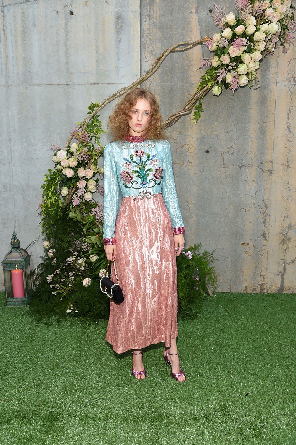 Model Petra Collins attends the Gucci Bloom Fragrance launch at MoMA PS.1 wearing a full Gucci look.