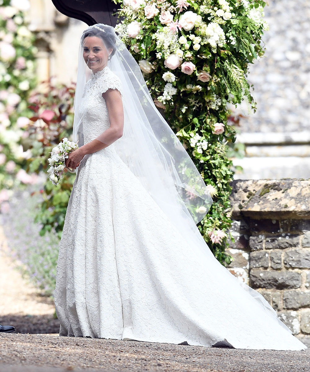 She teamed her stunning lace gown with a veil by renowned royal milliner Stephen Jones, a Maidenhair Fern tiara and Manolo Blahnik ivory satin pumps with pearl detailing.