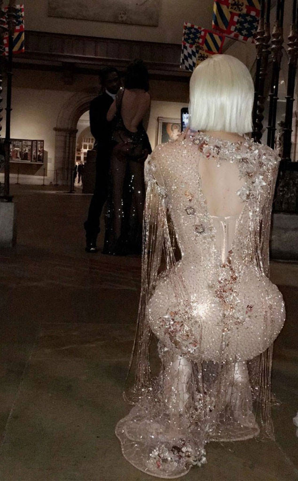 ...Then managed to take this sneaky snap of Kylie Jenner taking a picture of sister Kendall, posing with her not-so-secret boyfriend, A$AP Rocky.