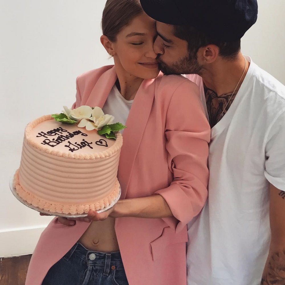 Gigi Hadid and boyfriend Zayn Malik hug as Gig holds her Birthday cake 