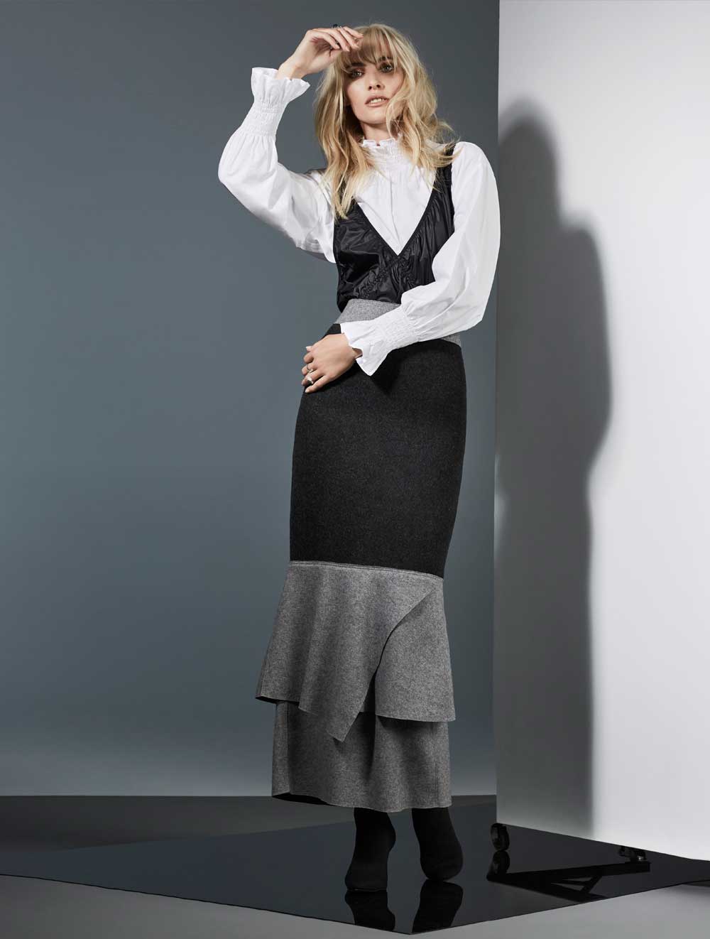 H&M blouse, $60. H&M Studio dress (worn as top), $70. Taylor dress (worn as skirt), $467. Sol Sana boots, $245.