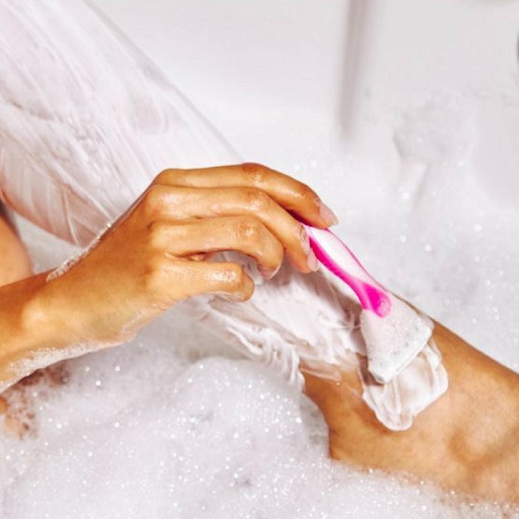 The Cosmetic Clinic free laser Ditch the Razor campaign - a woman shaves her legs in the bath