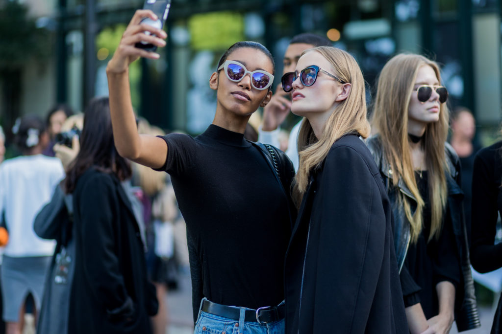 STOCKHOLM, SWEDEN - AUGUST 30: Models taking a selfie outside Ida SjÃ¶stedt during the second day of the Stockholm Fashion Week Spring/Summer 2017 on August 30, 2016 in Stockholm, Sweden. (Photo by Christian Vierig/Getty Images)