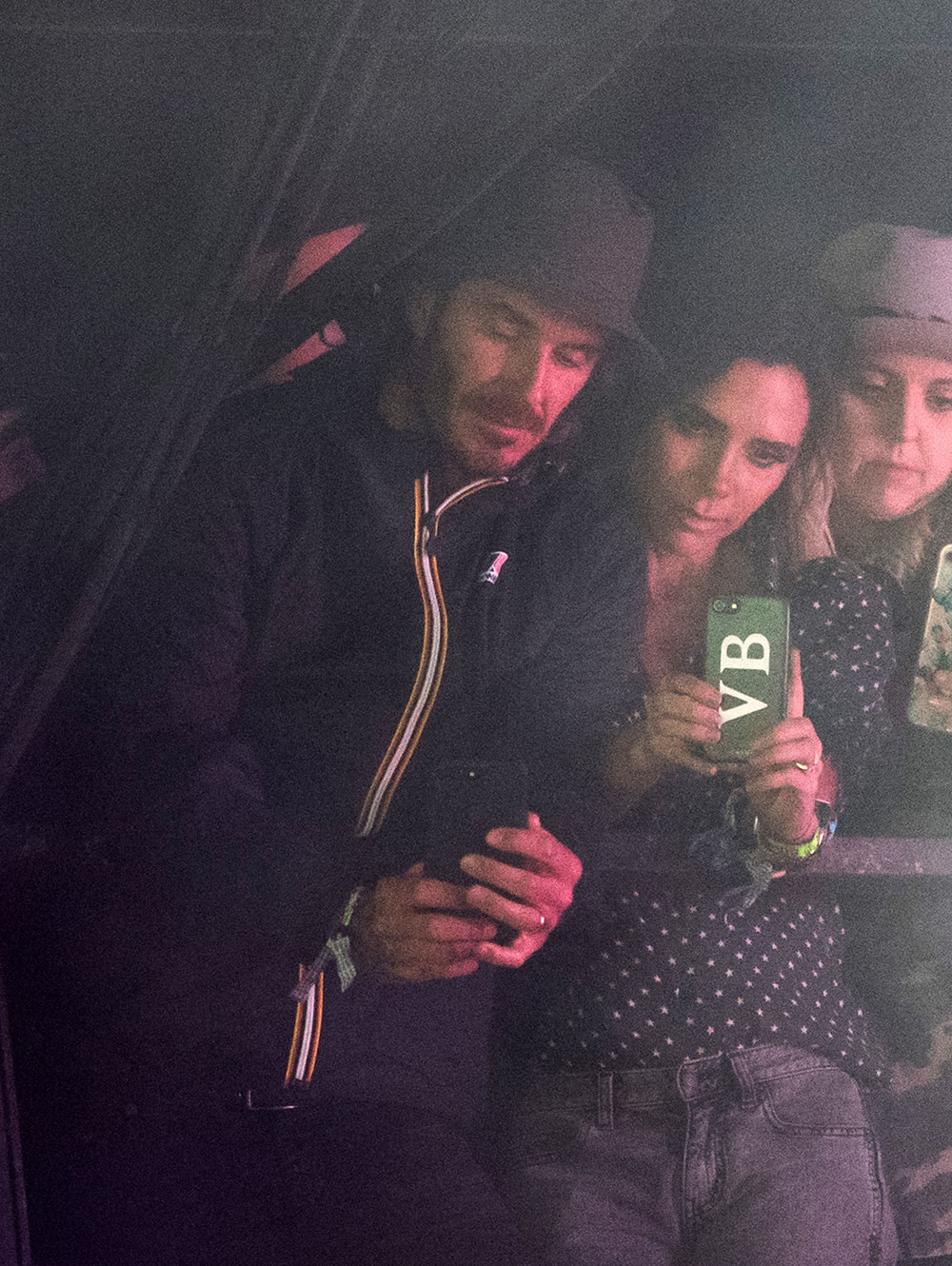 David and Victoria Beckham watch Sunday headliner Ed Sheeran from the side of the Pyramid Stage.