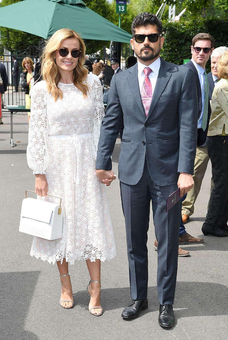 Welsh opera singer Katherine Jenkins took the Wimbledon whites dress code very seriously. Here she is pictured with husband Andrew Levitas.
