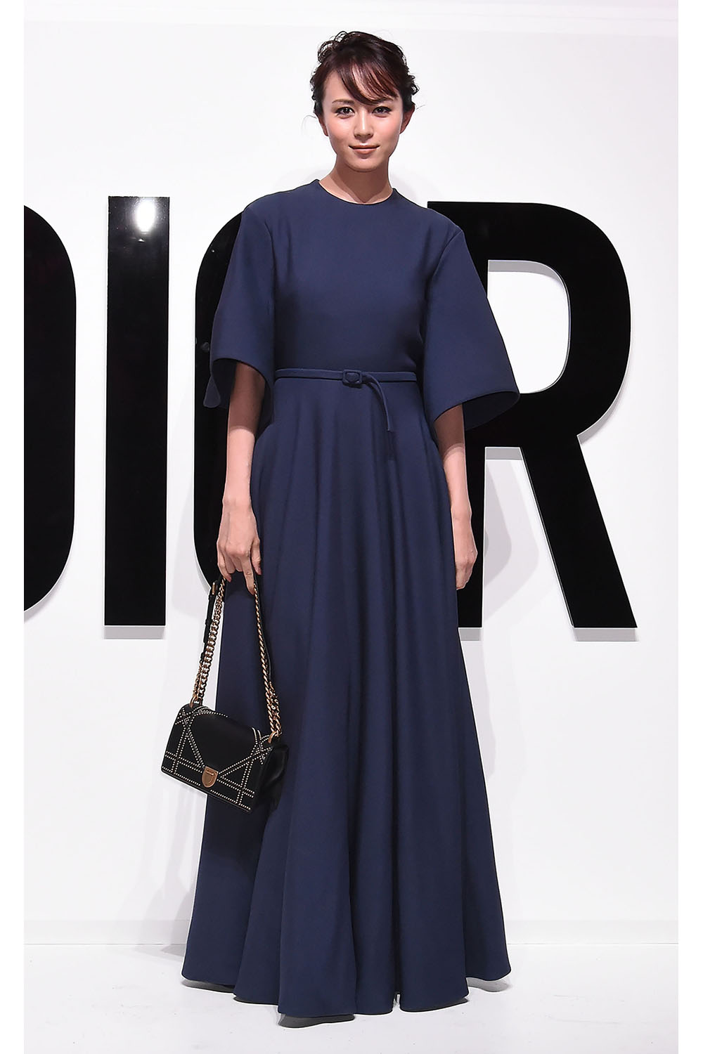 Actress Manami Higa attends the Dior For Love photocall in Tokyo wearing head-to-toe Christian Dior.