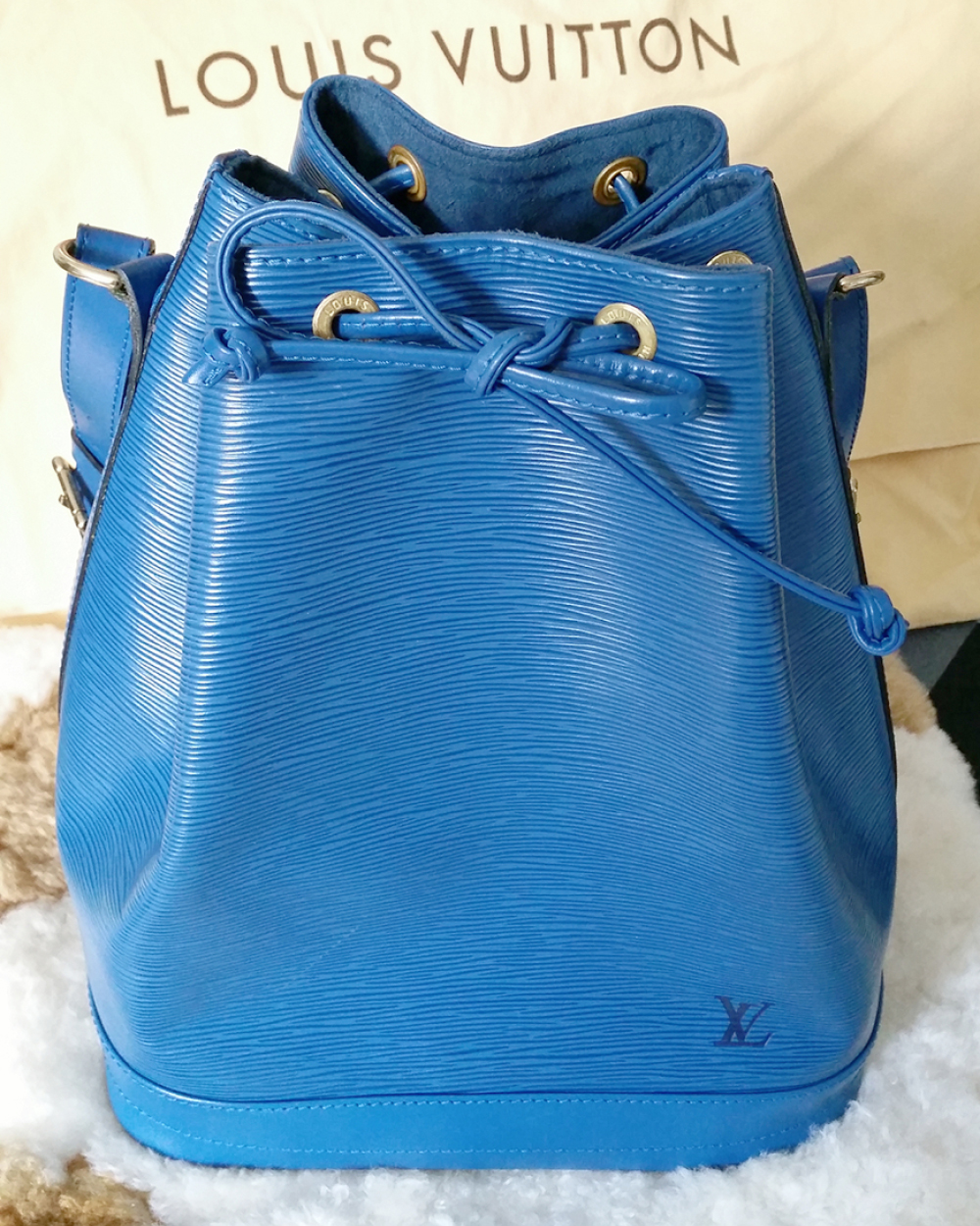 Louis Vuitton bag, $705