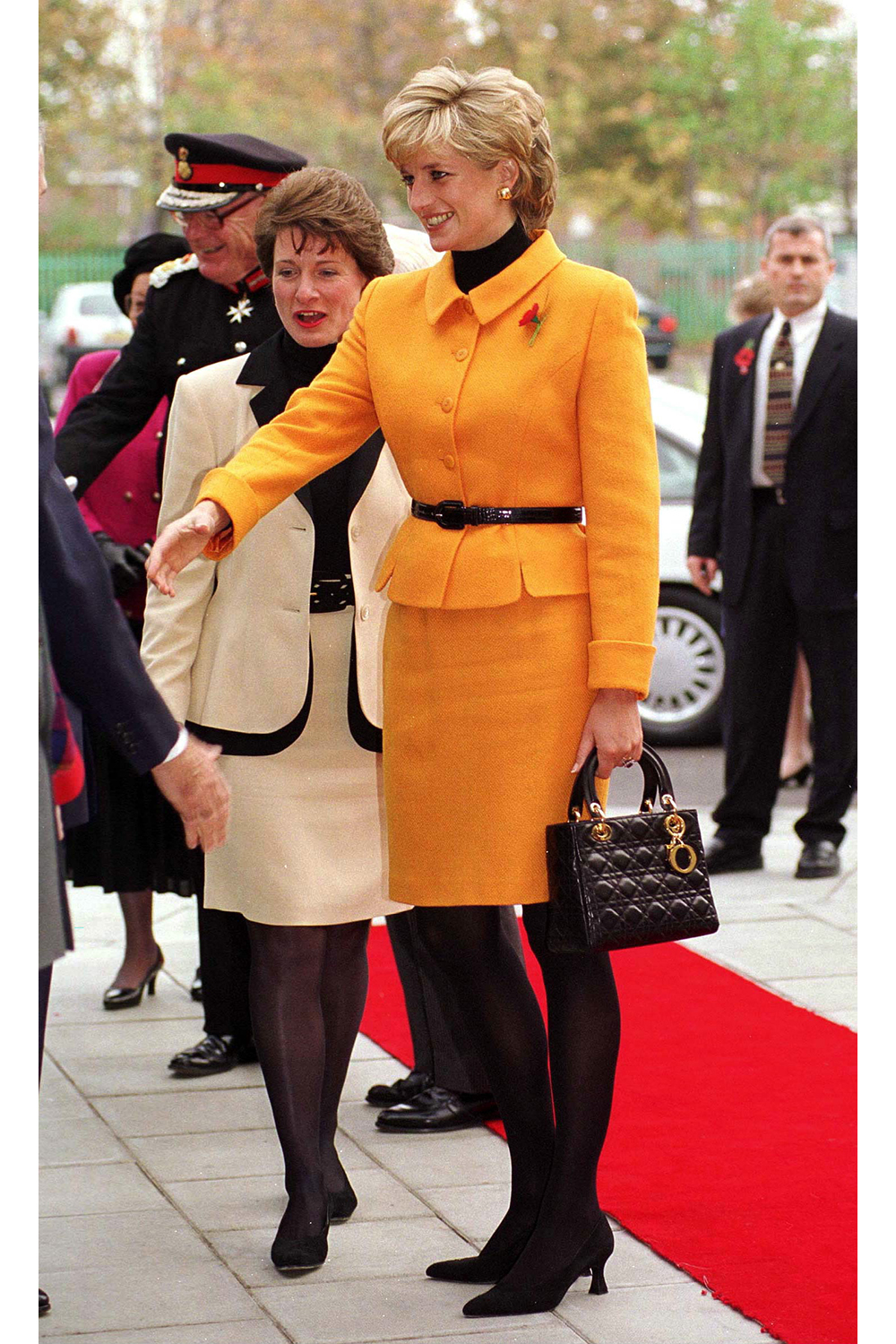 November 7th, 1995 - Princess Diana at the Liverpool Women's Hospital wearing a Versace suit and Christian Dior handbag.
