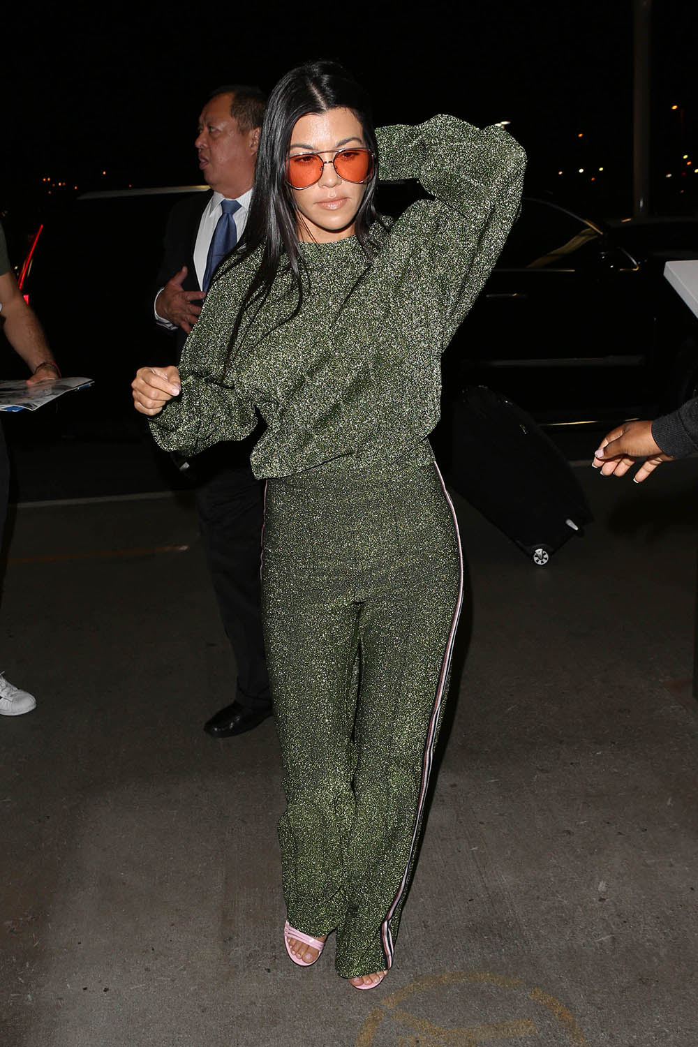 Kourtney Kardashian heads out in LA wearing a matching H&M tracksuit.