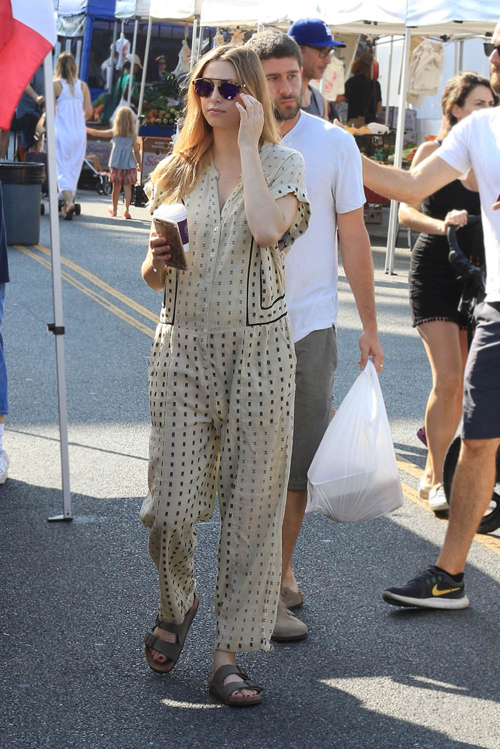 Whitney Port wears a casual-cool jumpsuit and Birkenstocks while shopping at a local market in LA.