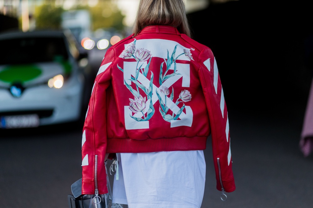 A guest wearing a red Off White leather jacket outside Saks Potts on August 10, 2017 in Copenhagen, Denmark.