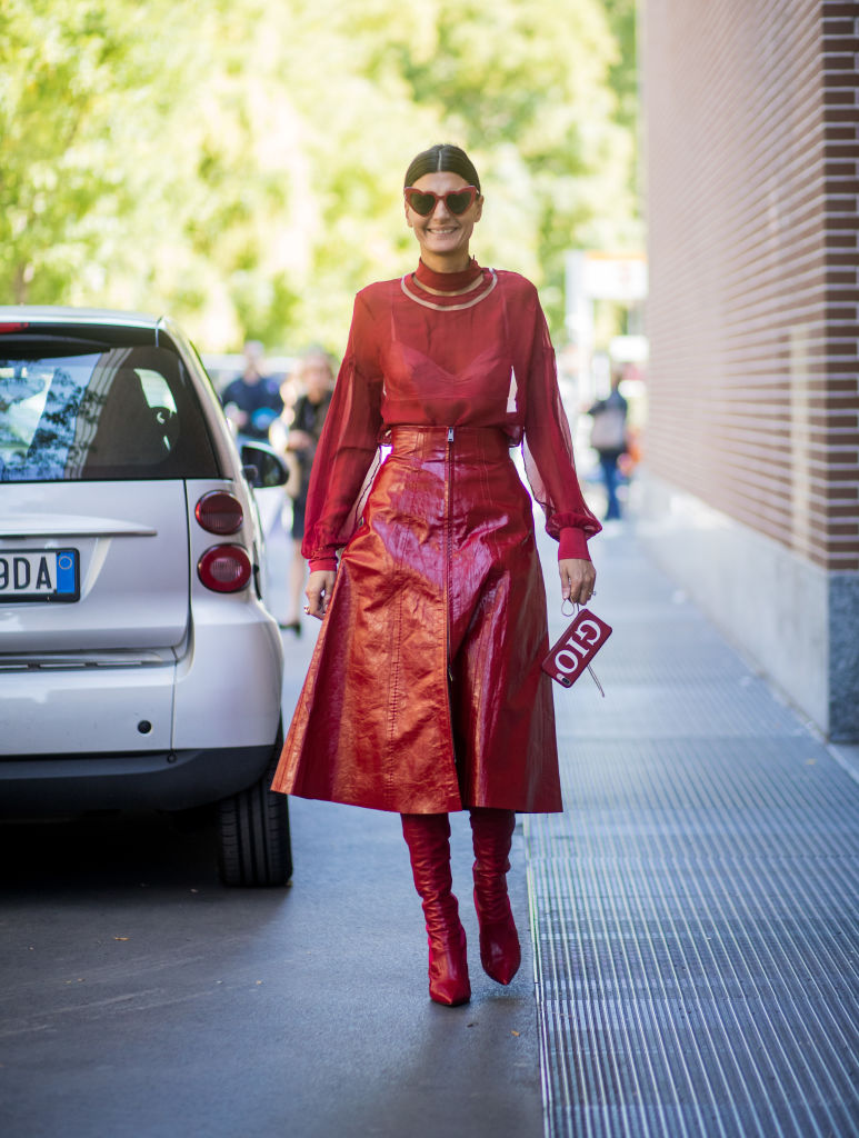 MILAN, ITALY - SEPTEMBER 21: Giovanna Engelbert wearing red blouse, red skirt, red overknees is seen outside Fendi during Milan Fashion Week Spring/Summer 2018 on September 21, 2017 in Milan, Italy. (Photo by Christian Vierig/Getty Images)