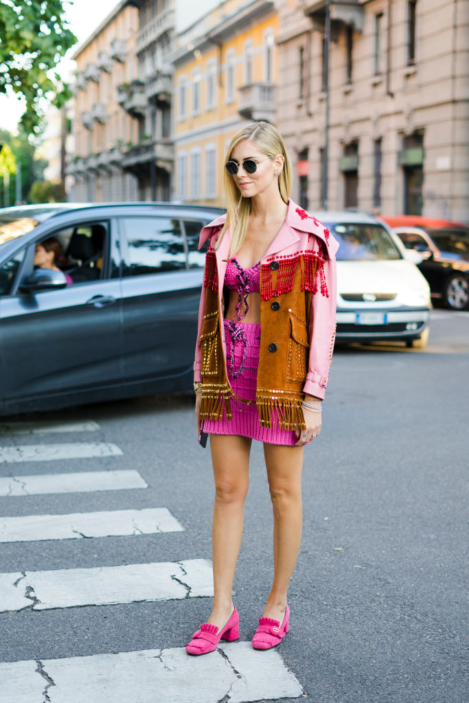 Chiara Ferragni wearing pink skirt and top, jacket with fringes is seen outside Prada during Milan Fashion Week Spring/Summer 2018 on September 21, 2017 in Milan, Italy. (Photo by Nataliya Petrova/NurPhoto via Getty Images)