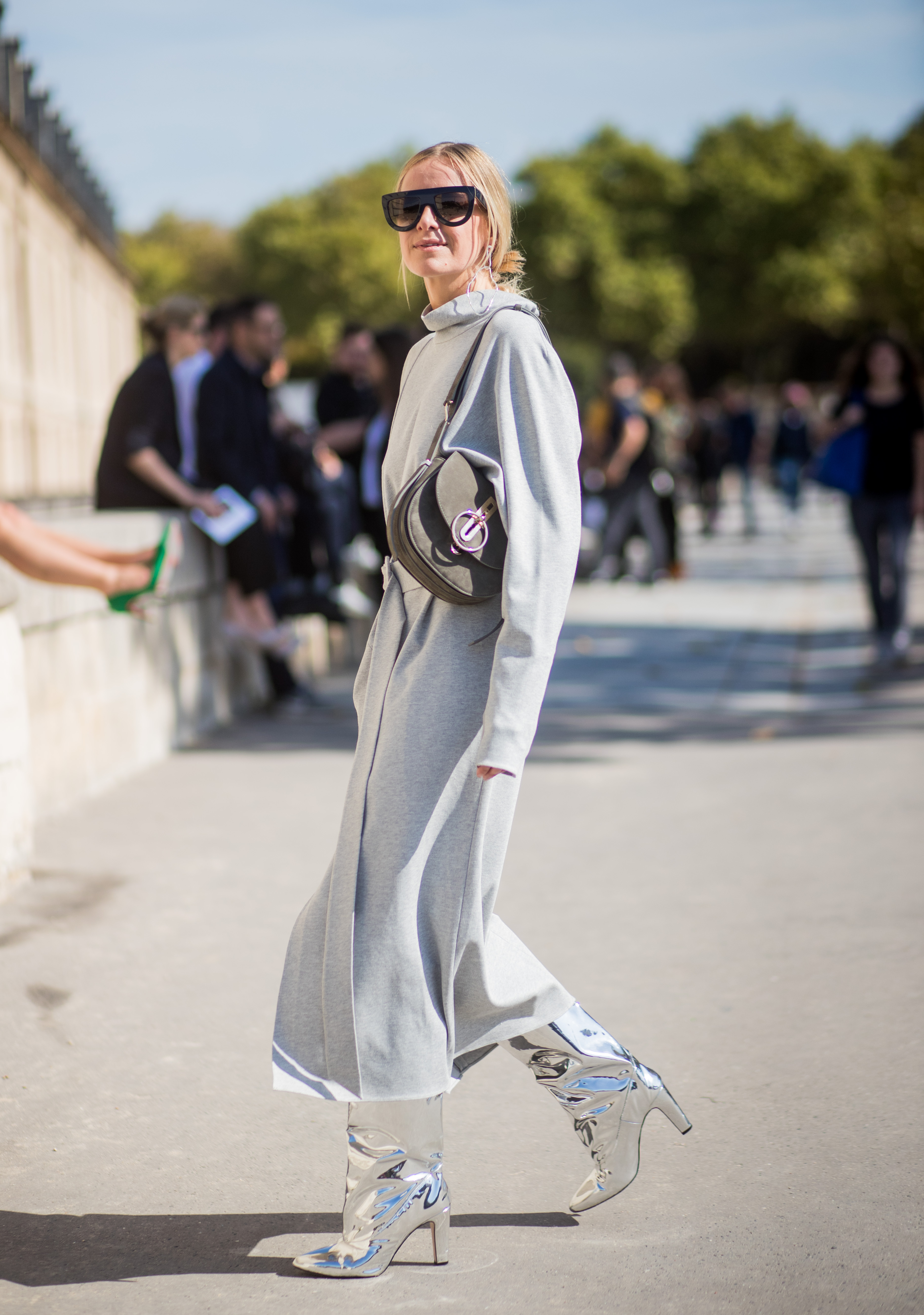 PARIS, FRANCE - SEPTEMBER 29: Celine Aagaard wearing silver boots, grey dress is seen outside Nina Ricci during Paris Fashion Week Spring/Summer 2018 on September 29, 2017 in Paris, France. (Photo by Christian Vierig/Getty Images)