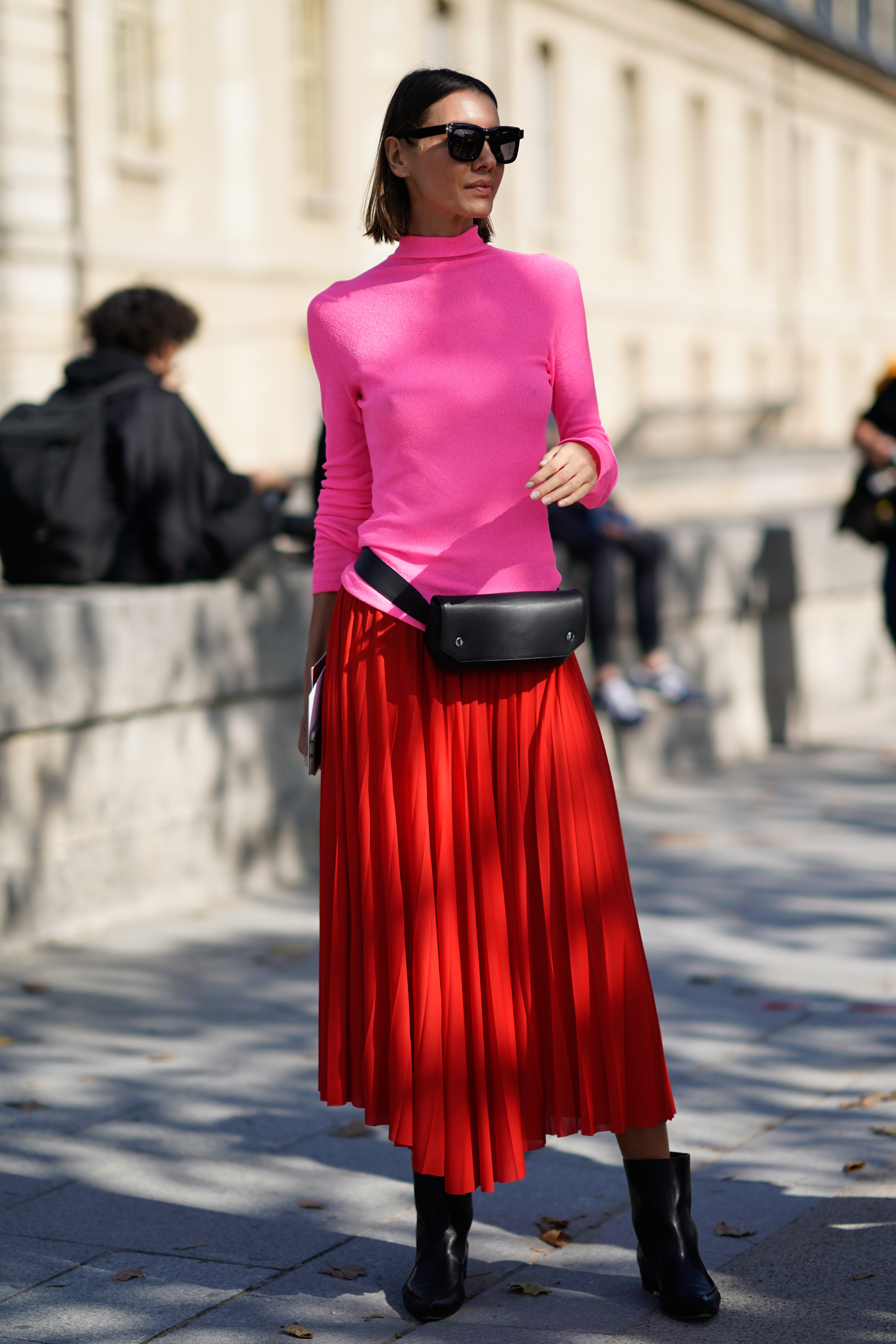 PARIS, FRANCE - SEPTEMBER 29: Julie Pelipas wears a pink top, a red pleated skirt, outside Nina Ricci, during Paris Fashion Week Womenswear Spring/Summer 2018, on September 29, 2017 in Paris, France. (Photo by Edward Berthelot/Getty Images For Nina Ricci)