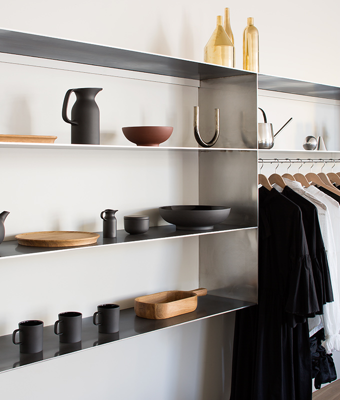 The brushed stainless steel shelving adds a robustness to the otherwise delicate interior.