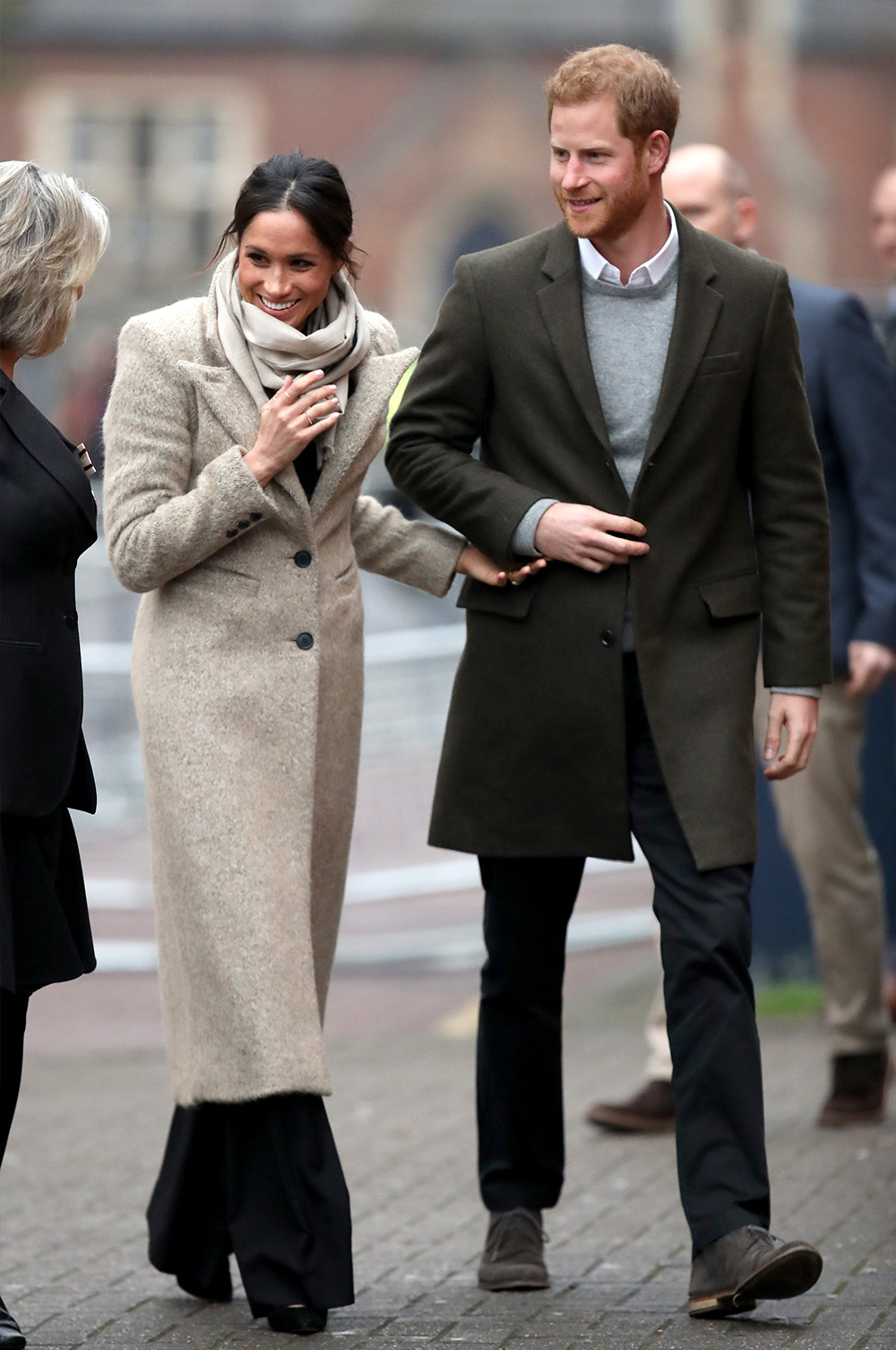 January 9, 2018: Meghan Markle visits Reprezent 107.3FM in London, England. She arrived in Brixton looking a little bit more laidback than we've seen her before (remember the Ralph & Russo gown in those engagement photos?), teaming a pair of wide leg trousers by Burberry with a Smythe coat, a Jigsaw scarf and swept-back hair.