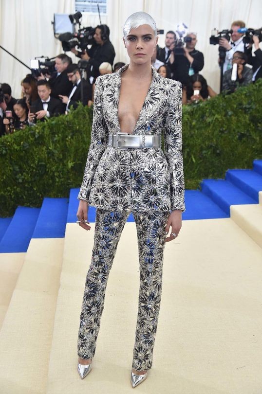 Cara Delevingne rocks a Chanel suit at the Met Gala.