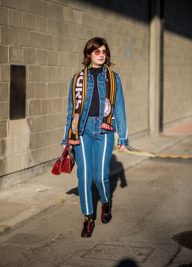 MILAN, ITALY - JANUARY 13: Valentina Siragusa wearing football scarf, denim jacket, denim jeans is seen outside Diesel during Milan Men's Fashion Week Fall/Winter 2018/19 on January 13, 2018 in Milan, Italy. (Photo by Christian Vierig/Getty Images)