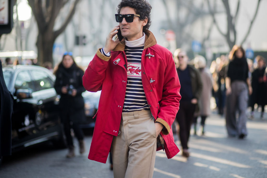 MILAN, ITALY - JANUARY 13: A guest wearing red jacket, striped shirt is seen outside Armani during Milan Men's Fashion Week Fall/Winter 2018/19 on January 13, 2018 in Milan, Italy. (Photo by Christian Vierig/Getty Images)