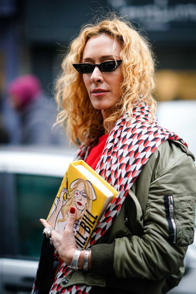 PARIS, FRANCE - JANUARY 25: Elina Halimi wears sunglasses, a scarf, a red top, a skirt, a yellow Kill Bill clutch, outside AF Vandervorst, during Paris Fashion Week -Haute Couture Spring/Summer 2018, on January 25, 2018 in Paris, France. (Photo by Edward Berthelot/Getty Images)