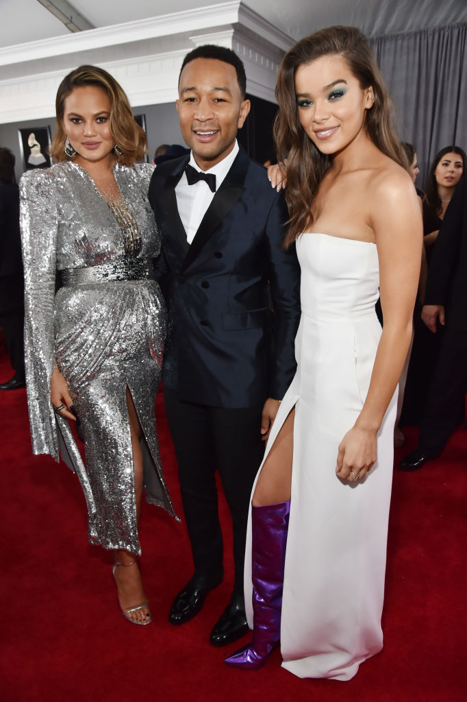 NEW YORK, NY - JANUARY 28: TV personality Chrissy Teigen (L), recording artist John Legend and recording artist and actor Hailee Steinfeld attend the 60th Annual GRAMMY Awards at Madison Square Garden on January 28, 2018 in New York City. (Photo by Kevin Mazur/Getty Images for NARAS)