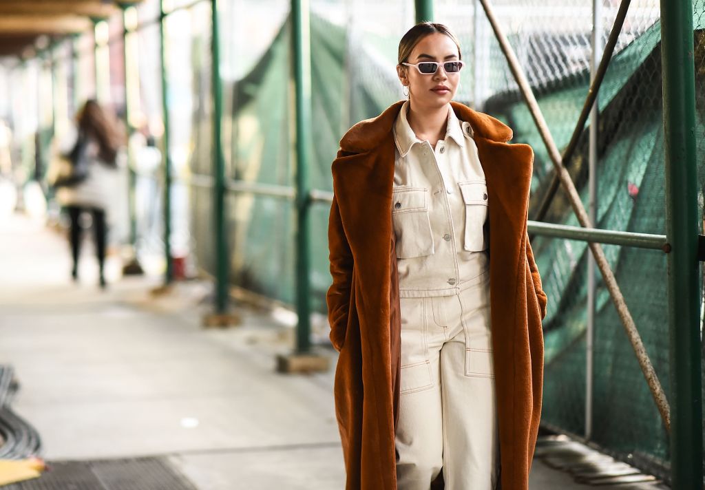 NEW YORK, NY - FEBRUARY 08: A guest is seen wearing a brown coat outside the Tadashi Shoji show during New York Fashion Week: Women's A/W 2018 on February 8, 2018 in New York City. (Photo by Daniel Zuchnik/Getty Images)