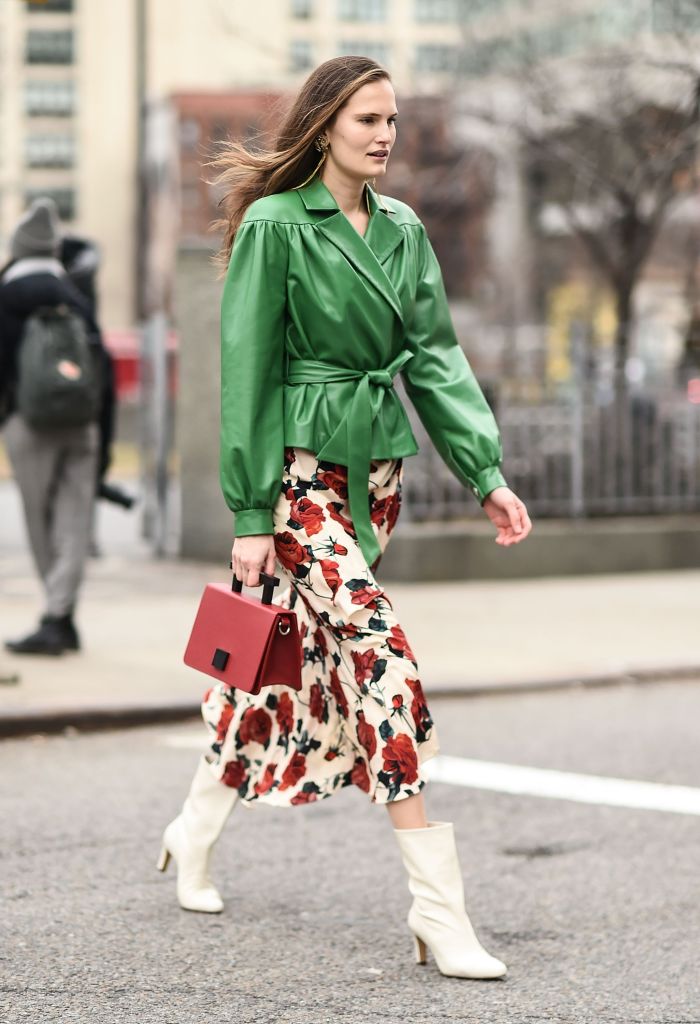 NEW YORK, NY - FEBRUARY 09: A model is seen wearing a green jacket and floral skirt outside the Brock Collection show during New York Fashion Week: Women's A/W 2018 on February 9, 2018 in New York City. (Photo by Daniel Zuchnik/Getty Images)