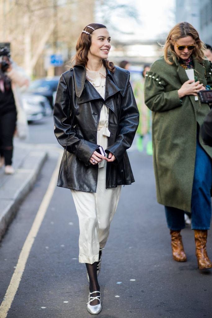 LONDON, ENGLAND - FEBRUARY 17: Alexa Chung wearing dress, black leather coat seen outside Simone Rocha during London Fashion Week February 2018 on February 17, 2018 in London, England. (Photo by Christian Vierig/Getty Images)