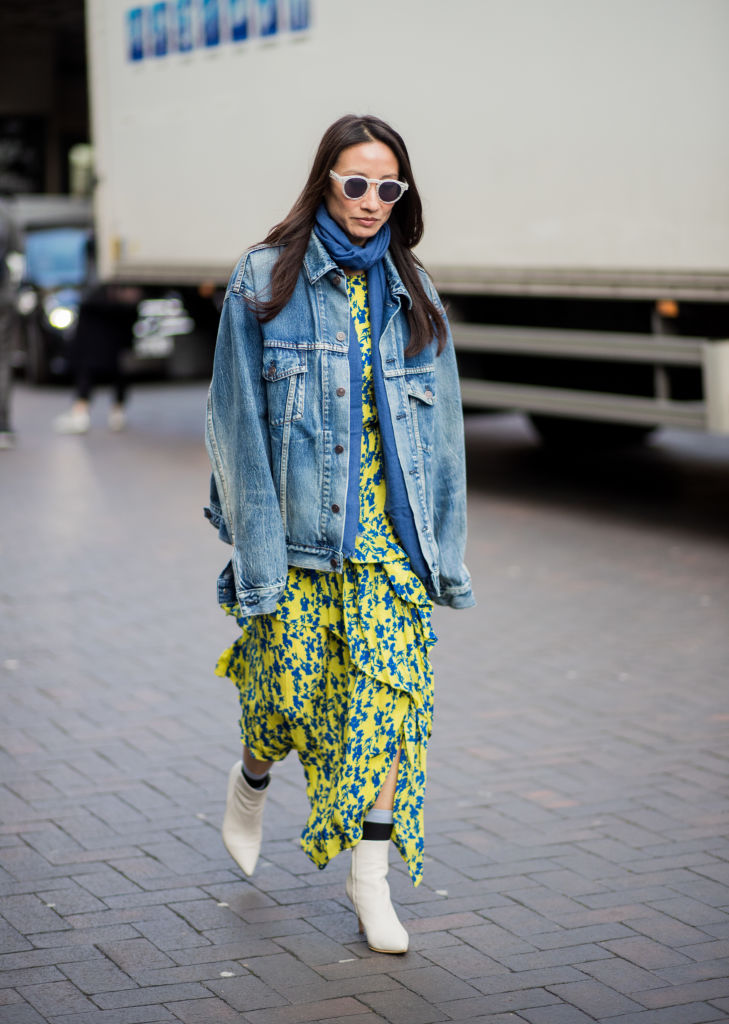 LONDON, ENGLAND - FEBRUARY 18: A guest wearing Balenciaga denim jacket seen outside Roland Mouret during London Fashion Week February 2018 on February 18, 2018 in London, England. (Photo by Christian Vierig/Getty Images)