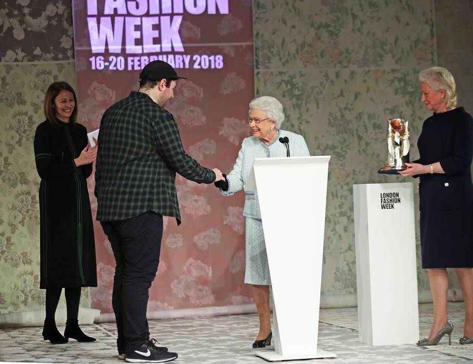 Queen makes an appearance on front row of London Fashion Week