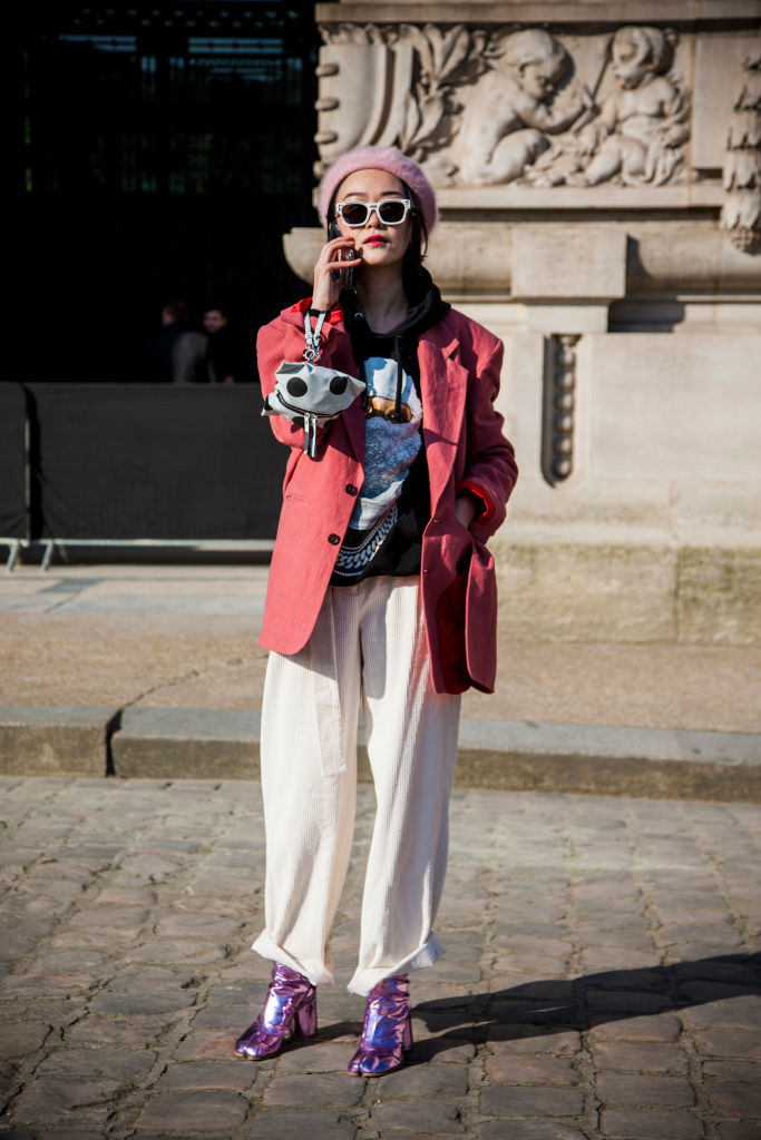 PARIS, FRANCE - FEBRUARY 28: A guest, wearing a pink jacket and a pink french hat, is seen in the streets of Paris before the Maison Margiela show during Paris Fashion Week Womenswear Fall/Winter 2018/2019 on February 28, 2018 in Paris, France. (Photo by Claudio Lavenia/Getty Images)