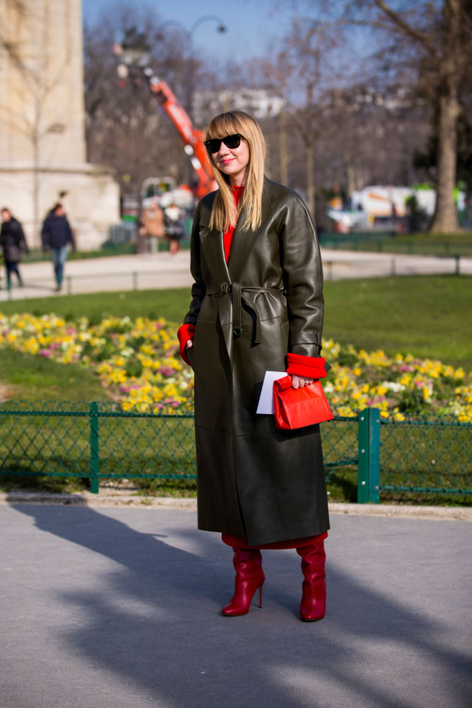PARIS, FRANCE - FEBRUARY 28: Lisa Aiken, wearing a green leather coat and red heels boots, is seen in the streets of Paris before the Maison Margiela show during Paris Fashion Week Womenswear Fall/Winter 2018/2019 on February 28, 2018 in Paris, France. (Photo by Claudio Lavenia/Getty Images)