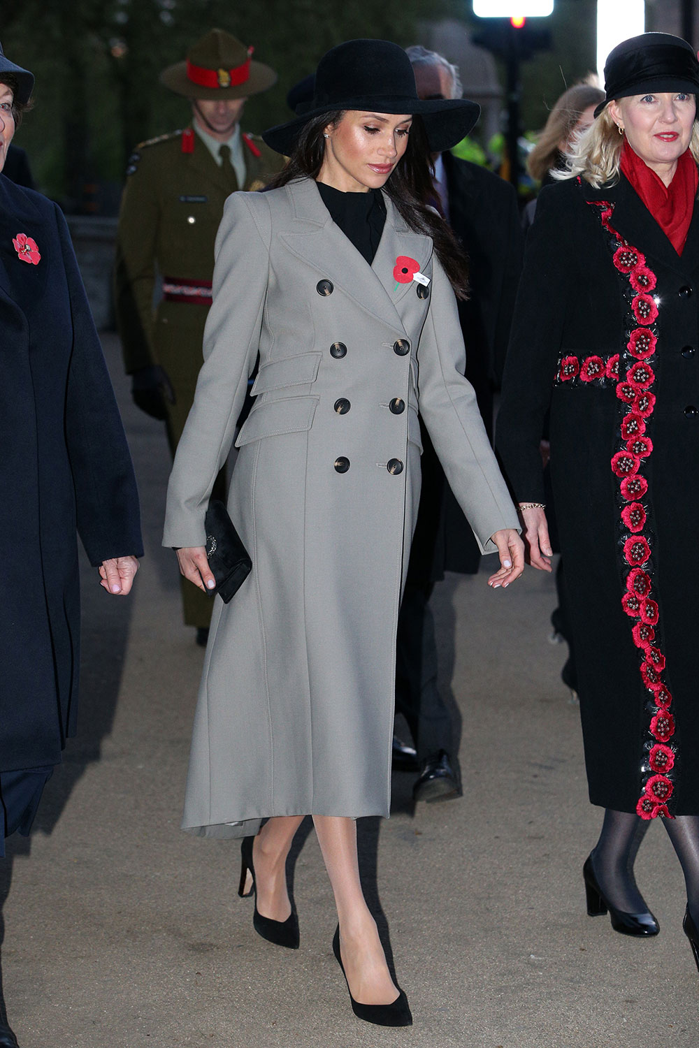April 25, 2018: Meghan Markle attended an ANZAC Day dawn service alongside New Zealand and Australian troops in London's Hyde Park Corner. She wore a Smythe coat  with Sarah Flint heels and carried a Gucci mini bag.