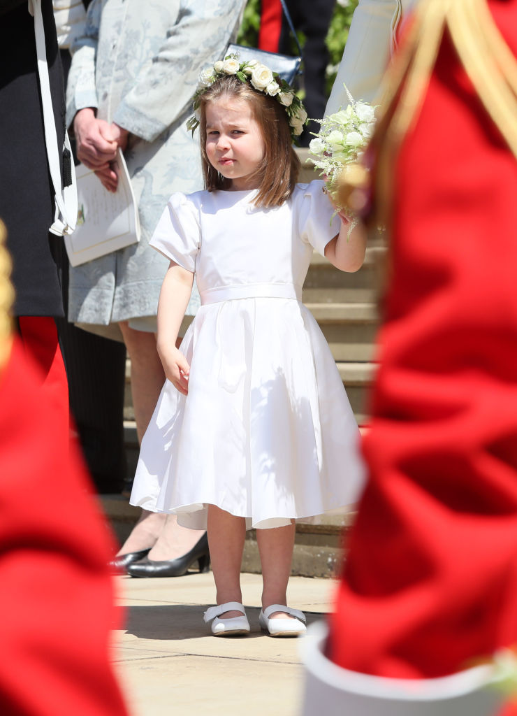 WINDSOR, UNITED KINGDOM - MAY 19: Princess Charlotte leaves St George's Chapel at Windsor Castle after the wedding of Prince Harry, Duke of Sussex and Meghan Markle on May 19, 2018 in Windsor, England. (Photo by Brian Lawless - WPA Pool/Getty Images)