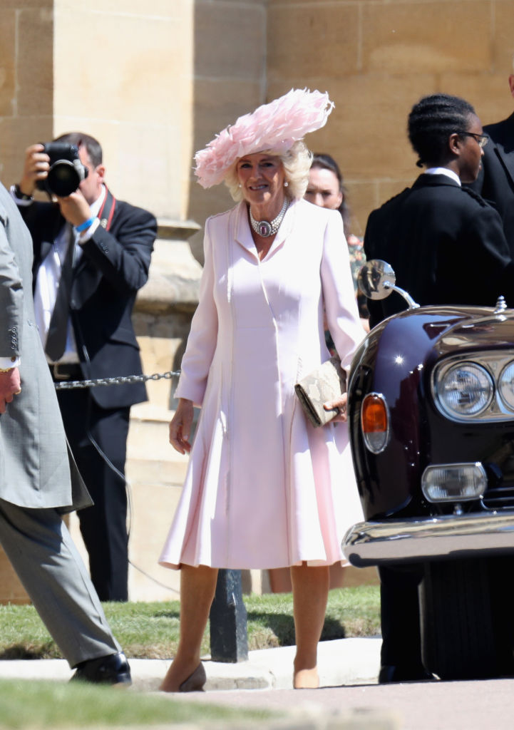 WINDSOR, ENGLAND - MAY 19: Camilla Duchess of Cornwall arrives at the wedding of Prince Harry to Ms Meghan Markle at St George's Chapel, Windsor Castle on May 19, 2018 in Windsor, England. Prince Henry Charles Albert David of Wales marries Ms. Meghan Markle in a service at St George's Chapel inside the grounds of Windsor Castle. Among the guests were 2200 members of the public, the royal family and Ms. Markle's Mother Doria Ragland. (Photo by Chris Jackson/Getty Images)